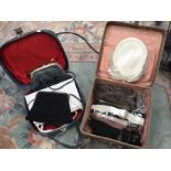 A 1950's vanity case containing a collection of gloves and two faux fur collars,