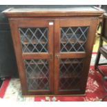 A 20th Century oak glazed bookcase