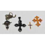 A late 19th century Continental cross set in white metal with dark blue enamel and paste stones,