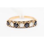 A 9ct gold cz and sapphire ring, set with alternating stones, seven stones in total, size M,