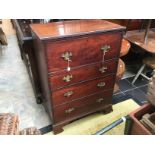 A George III mahogany secretaire chest, the secretaire section with fitted drawers and pigeon holes,
