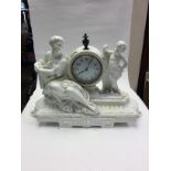 A white 19th Century Romanesque mantle clock by Moores Brothers,
