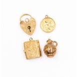 Four 9ct gold charms, combined weight approx 6.