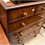 A Victorian mahogany chest of drawers with bun feet,