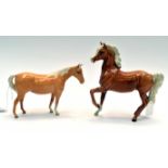 A Beswick palomino prancing horse,