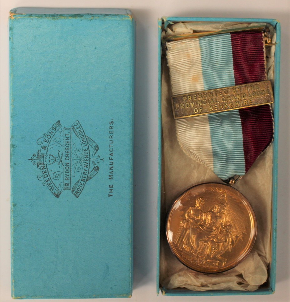 A 9 ct rose gold mounted Masonic medal with ribbon presented by the Official Gavel Lodge of