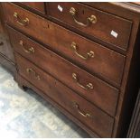 A George III oak chest of drawers, fitted with two short over three long graduated drawers,