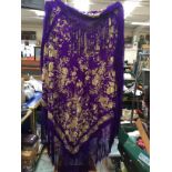 A 1880's silk shawl, in purple with dark cream embroidery (approx 160cm square),
