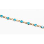 A blue topaz bracelet, oval blue topaz claw set with 14k open cross over links, length approx 7.