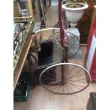 A late 19th / early 20th Century small pony trap, with solid rubber tyres, steel frame, painted red,