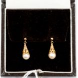 A pair of 9ct gold and pearl set earrings,