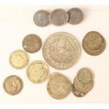 A collection of silver coins, including 1890 Silver Dollar, 1896 Sixpence, 1888 Sixpence,