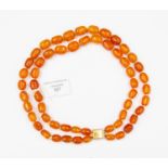 Amber beads, re-threaded as a two rope necklace, professionally done,