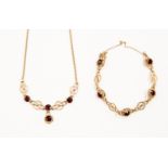 A 9ct gold and garnet coloured paste necklace and bracelet,