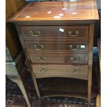 An Edwardian mahogany music cabinet,