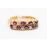 A ruby and diamond ring, double rows set with alternating ruby and diamonds, unmarked yellow metal,