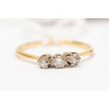 An 18ct yellow gold and platinum three stone diamond ring, total diamond weight approx 0.