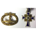 Reproduction WW2 Third Reich 1st pattern Mothers Cross and Reproduction U Boat badge.