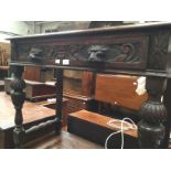 Oak occasional table complete with leonine handled draws.