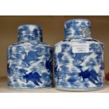 A pair of 19th Century Chinese jars and covers with Carp decoration blue and white underglaze mark