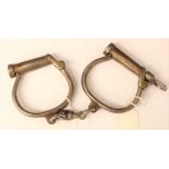 A pair of 19th Century Hiatt made Police Handcuffs. All steel construction.