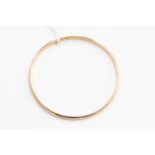 A 9ct gold plain polished slave bangle, internal diameter approx 70mm, weight approx 16.