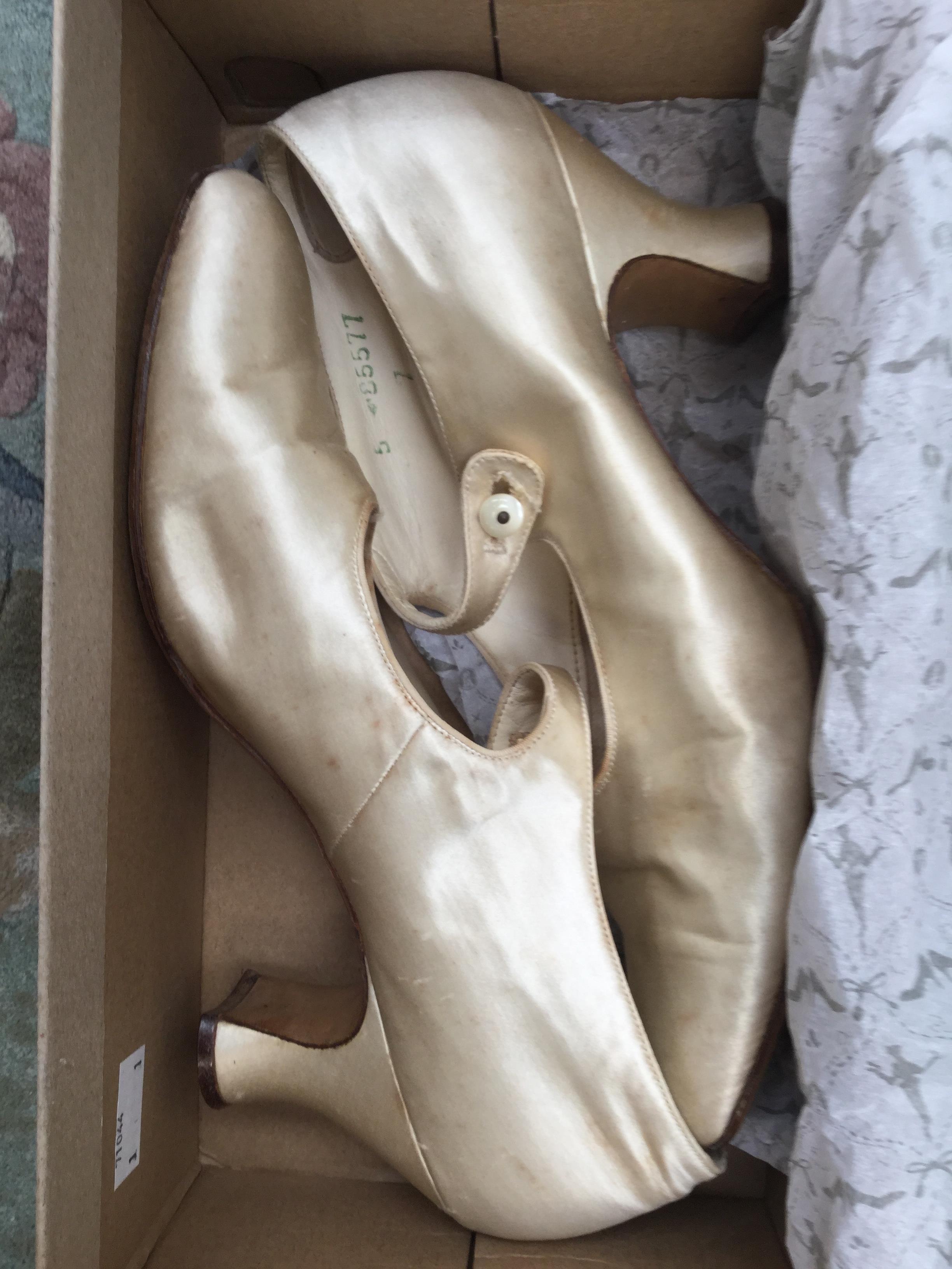 A pair of white silk 1920's wedding shoes
