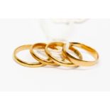 Four 18ct gold wedding bands combined total gross weight 8.