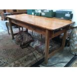 A 1950's two drawer, plank top kitchen table.