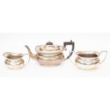 A George V three piece silver tea service, Birmingham 1931 comprising of teapot, milk jug,