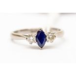 A sapphire and diamond three stone dress ring, the marquise cut sapphire approx 0.