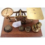 Social history interest; a set of postal scales circa 1880, mounted on an oak stand,