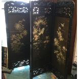 An oriental four panelled screen with silk embridery ,