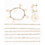 A collection of silver necklaces, including a hollow barrel interlinked necklace,