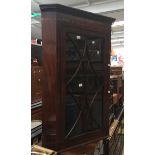 A 19th Century mahogany glazed corner cabinet,