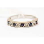 A sapphire and diamond half set eternity ring, set with alternate round sapphires and diamonds,