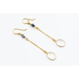 A pair of sapphire and moonstone drop earrings oval sapphire to the top with suspended chain to