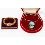 A Carmen adjustable gold filled bracelet, set with paste stones to hinged locket,