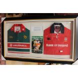A pair of framed and glazed rugby shirts, of local interest, signed to the back of the frame.