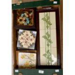 A collection of assorted tiles and stands, comprising two teapot stands, an Arts & Crafts tray,