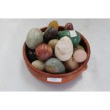 A collection of assorted agates, including rose quartz, onyx,