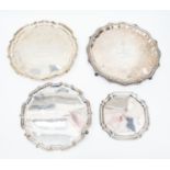 Four various early 20th Century salvers, of graduating sizes, each with presentation inscriptions,