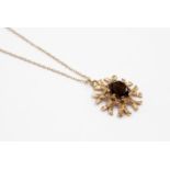 A 9ct gold smoky quartz single stone pendant necklace,