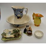 A collection of ceramics comprising bowl, jug and soap dish set, a Burleigh ware Squirrel jug,