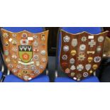 A collection of British & World Fire Brigade cap badges mounted on two wooden shields with