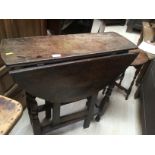 A late 17th Century joined oak gate leg table,