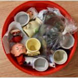 Collection of miniature glass bottles, including Boots the Chemist, along with novelty egg cups,