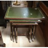 Modern nest of tables with leather top.