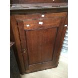 Hanging corner cabinet in oak. early 20th century.