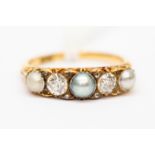 An Edwardian pearl and diamond ring, claw set in 18ct gold,